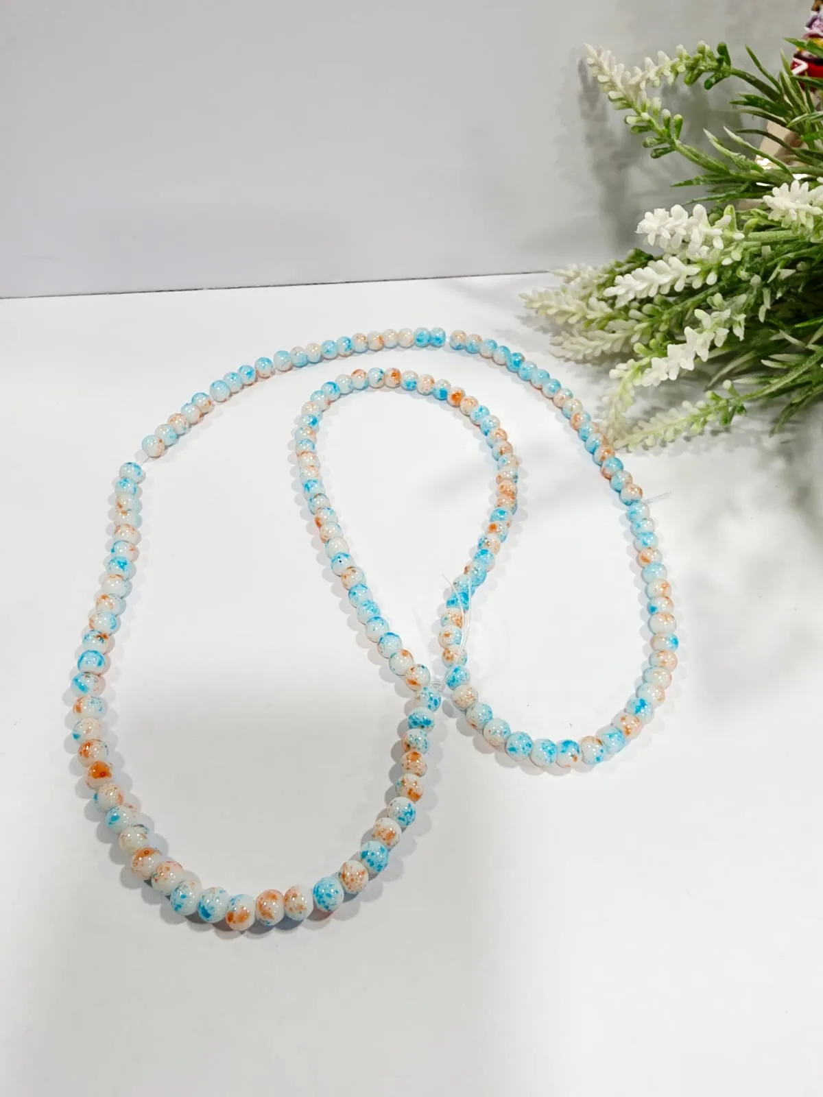 Cuentas de Vidrio Jaspeado Crema con Salpicado Celeste y Naranja 6mm
