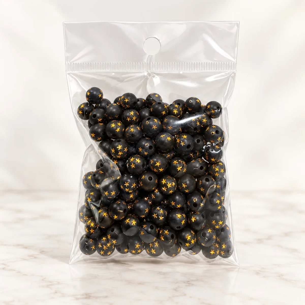 Cuentas Acrílicas Negro con Estrellas y Puntos Dorados 8 mm