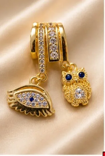 Charm en Rodio - Ojo con piedra azul y buho con piedras blancas